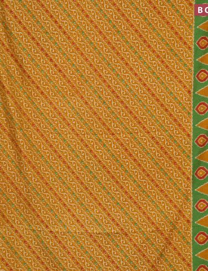 Semi tussar saree mustard yellow and green with allover ikat prints and zari woven border