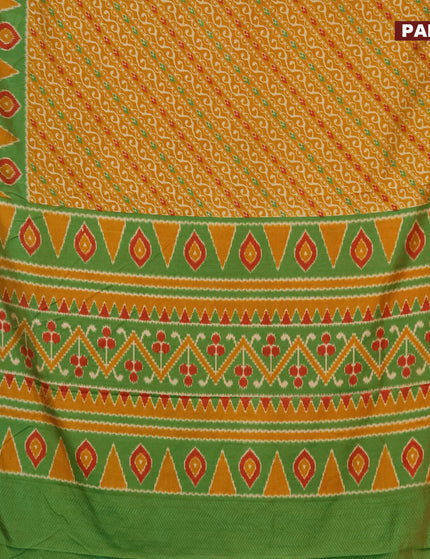 Semi tussar saree mustard yellow and green with allover ikat prints and zari woven border