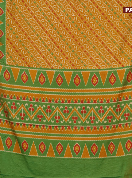 Semi tussar saree mustard yellow and green with allover ikat prints and zari woven border