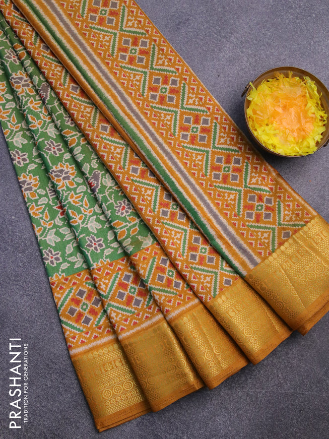 Semi tussar saree green and mustard shade with allover ikat prints and zari woven border