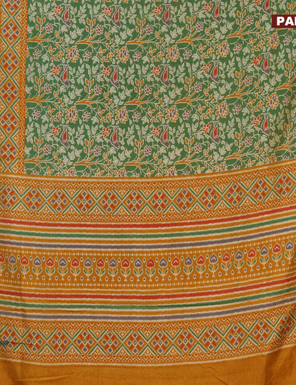 Semi tussar saree green and mustard shade with allover ikat prints and zari woven border