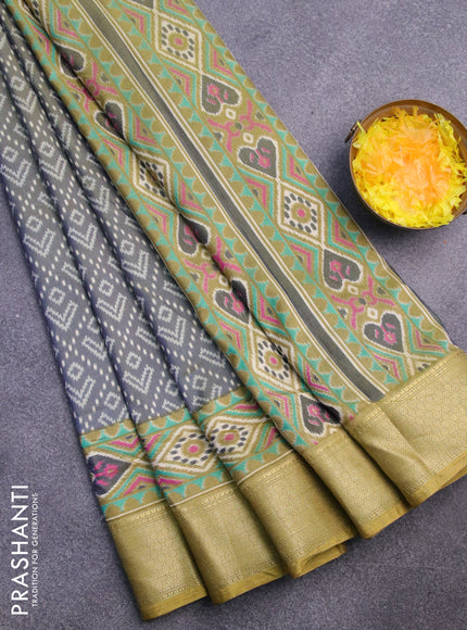 Semi tussar saree dual shade of greyish green and elaichi green with allover ikat prints and zari woven border