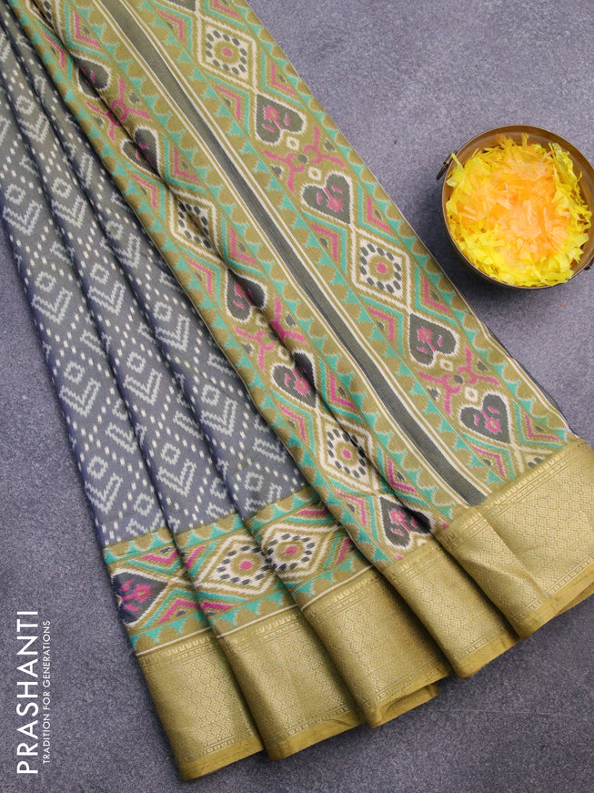 Semi tussar saree dual shade of greyish green and elaichi green with allover ikat prints and zari woven border