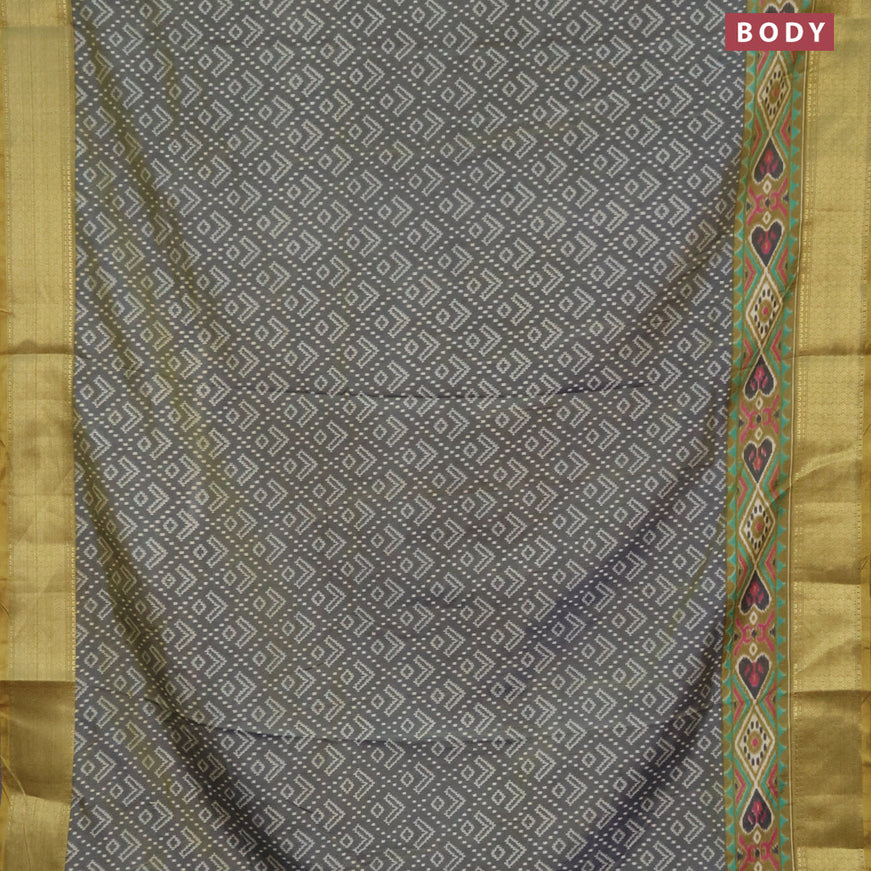 Semi tussar saree dual shade of greyish green and elaichi green with allover ikat prints and zari woven border