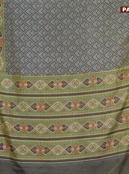 Semi tussar saree dual shade of greyish green and elaichi green with allover ikat prints and zari woven border