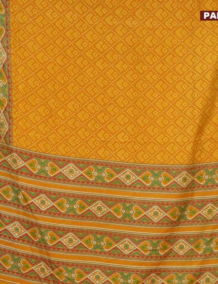 Semi tussar saree mustard yellow and elaichi green with allover ikat prints and zari woven border