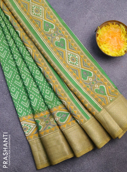 Semi tussar saree green shade with allover ikat prints and zari woven border