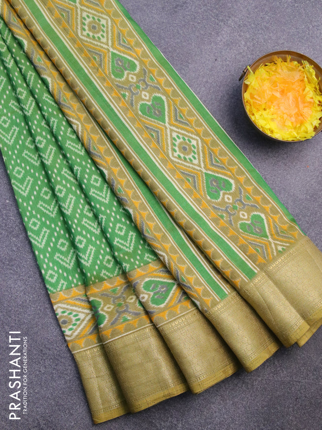 Semi tussar saree green shade with allover ikat prints and zari woven border