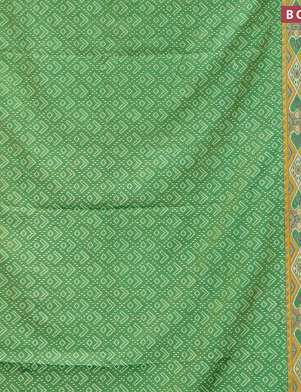 Semi tussar saree green shade with allover ikat prints and zari woven border