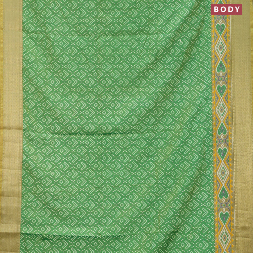 Semi tussar saree green shade with allover ikat prints and zari woven border