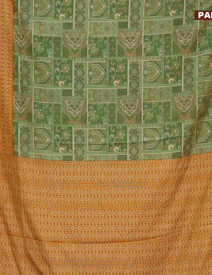 Semi tussar saree green shade and mustard shade with allover ikat prints and zari woven border