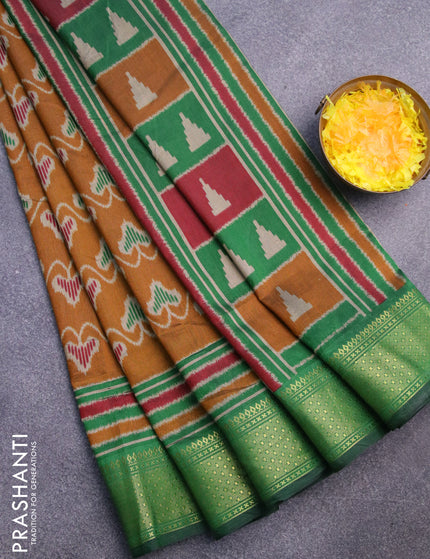 Semi tussar saree mustard shade and green with allover ikat prints and zari woven border