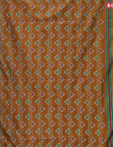 Semi tussar saree mustard shade and green with allover ikat prints and zari woven border