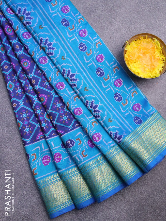 Semi tussar saree dark blue and teal blue with allover ikat prints and zari woven border