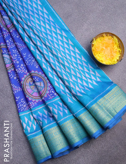 Semi tussar saree blue and teal blue with allover madhupani prints and zari woven border