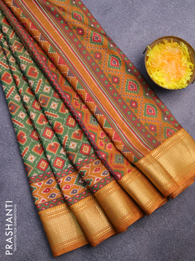 Semi tussar saree green and dark mustard with allover ikat prints and zari woven border