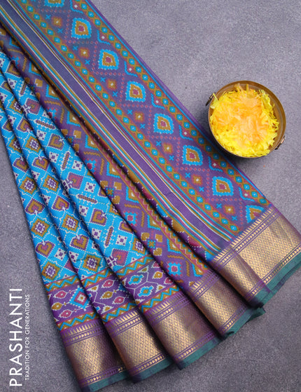 Semi tussar saree dual shade of teal blue and dual shade of violet with allover ikat prints and zari woven border