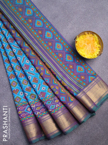 Semi tussar saree dual shade of teal blue and dual shade of violet with allover ikat prints and zari woven border