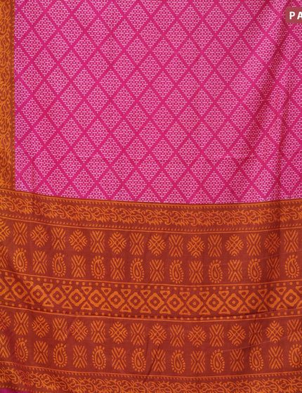 Semi tussar saree pink and rustic orange with allover butta prints and zari woven border