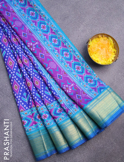 Semi tussar saree blue and cs blue with allover ikat prints and zari woven border