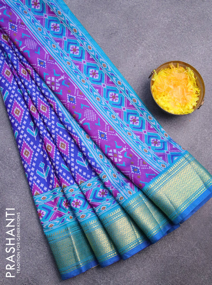 Semi tussar saree blue and cs blue with allover ikat prints and zari woven border