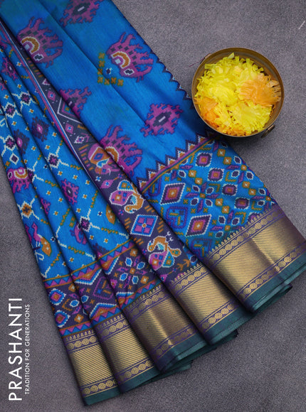 Semi tussar saree dual shade of teal blue and dual shade of violet with allover ikat prints and zari woven border