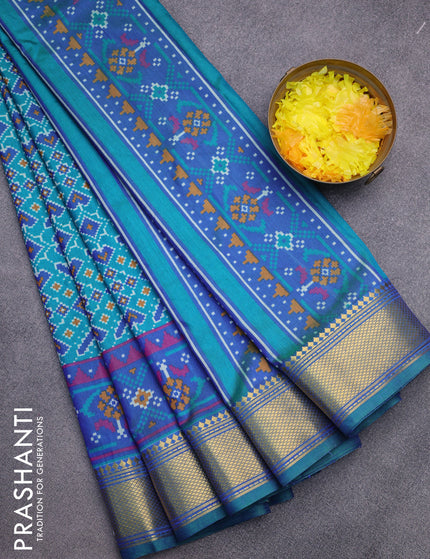 Semi tussar saree teal green and dual shade of blue with allover ikat prints and zari woven border