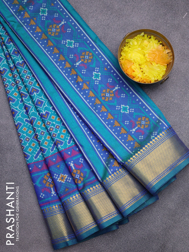 Semi tussar saree teal green and dual shade of blue with allover ikat prints and zari woven border