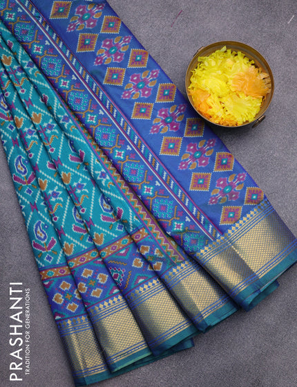 Semi tussar saree teal green and blue with allover ikat prints and zari woven border