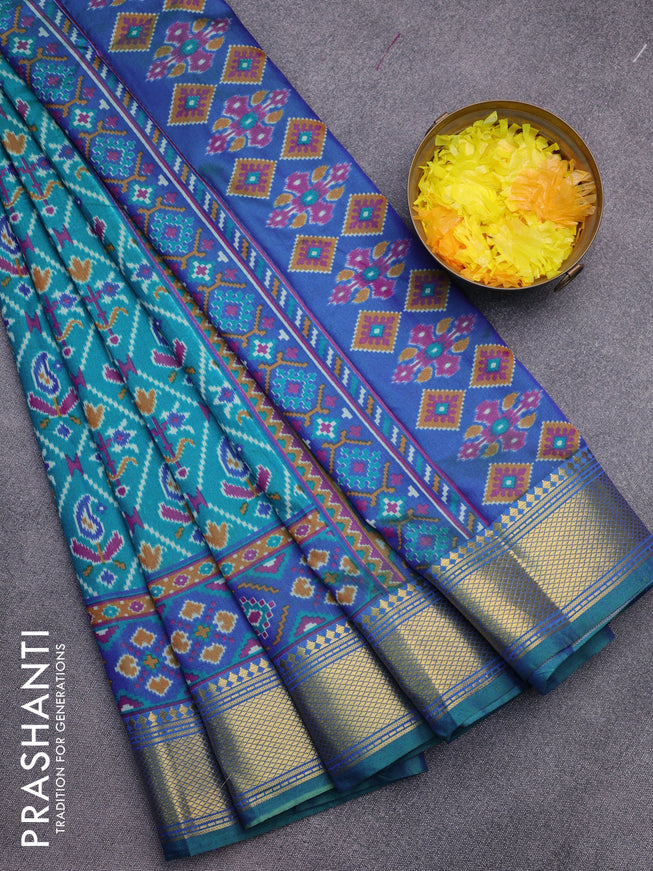 Semi tussar saree teal green and blue with allover ikat prints and zari woven border