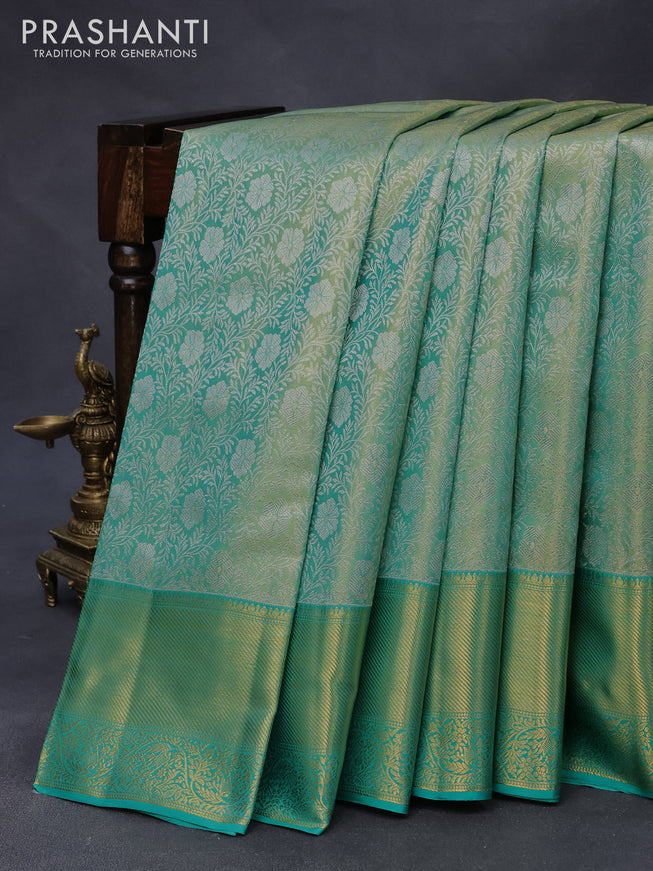 Pure kanjivaram tissue silk saree teal green with allover silver zari woven brocade weaves and zari woven border