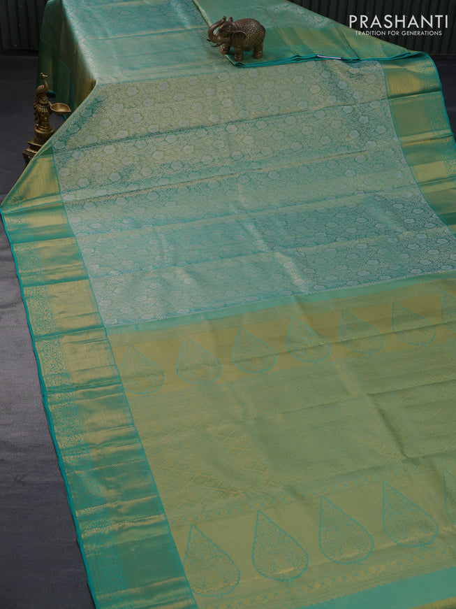 Pure kanjivaram tissue silk saree teal green with allover silver zari woven brocade weaves and zari woven border