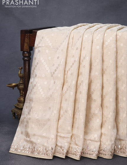 Banarasi silk saree cream with allover zari weaves and zari woven gottapatti lace work border