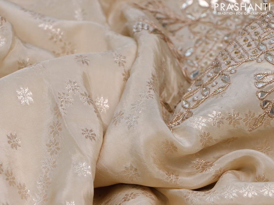 Banarasi silk saree cream with allover zari weaves and zari woven gottapatti lace work border