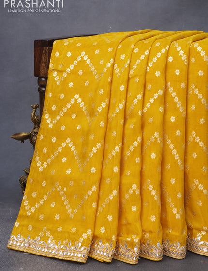 Banarasi silk saree yellow with allover zari weaves and zari woven gottapatti lace work border