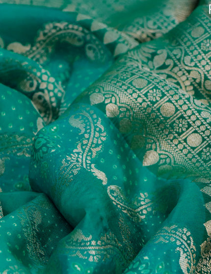 Georgette silk saree teal green with allover zari woven banarasi weaves and zari woven gottapatti lace work border