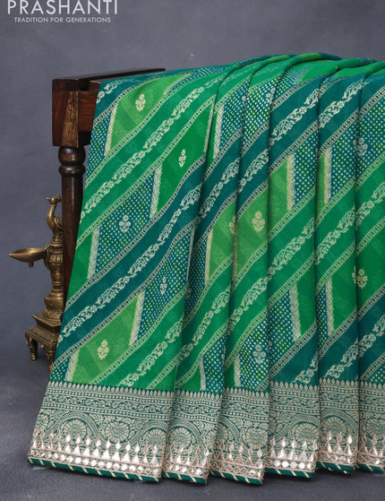 Georgette silk saree green and teal green with allover zari woven banarasi weaves and zari woven gottapatti lace work border