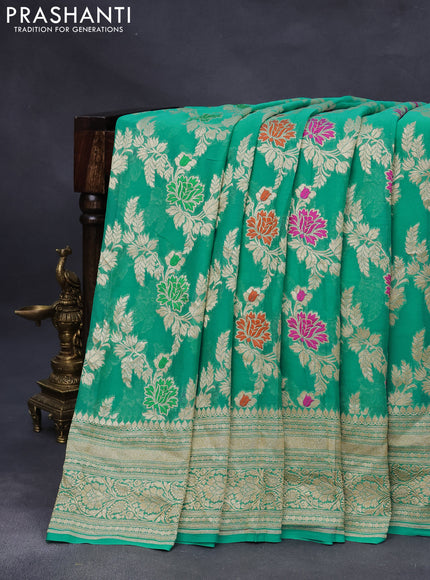 Banarasi georgette silk saree teal blue with allover floral design thread & zari weaves and woven border