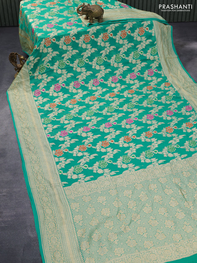 Banarasi georgette silk saree teal blue with allover floral design thread & zari weaves and woven border