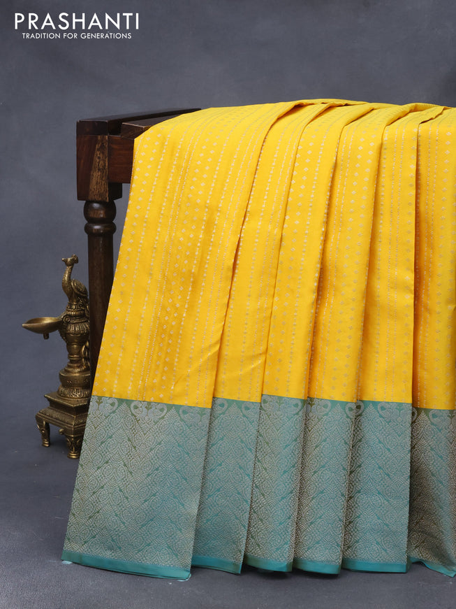 Pure kanjivaram silk saree mango yellow and dual shade of teal blue with allover silver zari weaves and silver zari woven border