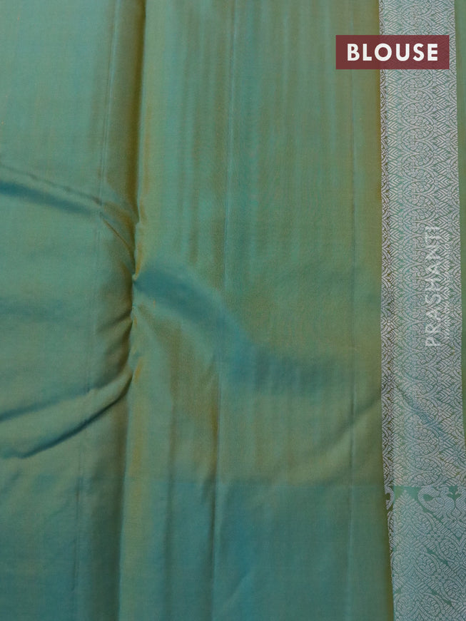 Pure kanjivaram silk saree mango yellow and dual shade of teal blue with allover silver zari weaves and silver zari woven border