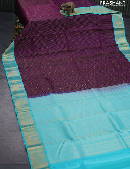 Pure kanjivaram silk saree deep purple and teal blue with allover zari weaves and zari woven korvai border