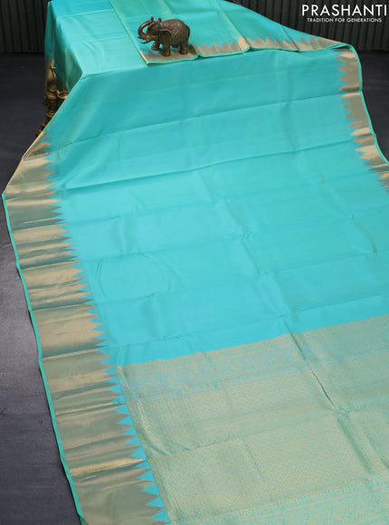 Pure kanjivaram silk saree teal blue with plain body and temple design zari woven border