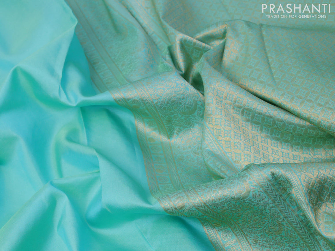 Pure kanjivaram silk saree teal blue with plain body and temple design zari woven border