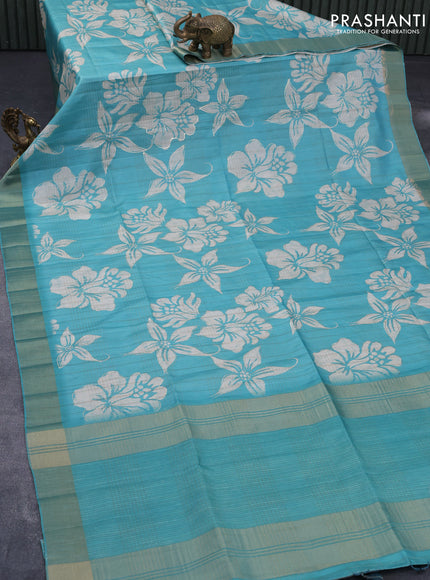 Semi matka foil printed saree teal blue with allover floral prints & zari weaves and zari woven border