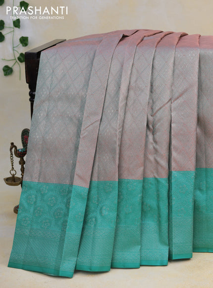 Pure kanjivaram tissue silk saree dual shade of peach and teal blue with allover silver zari weaves and long silver zari woven border