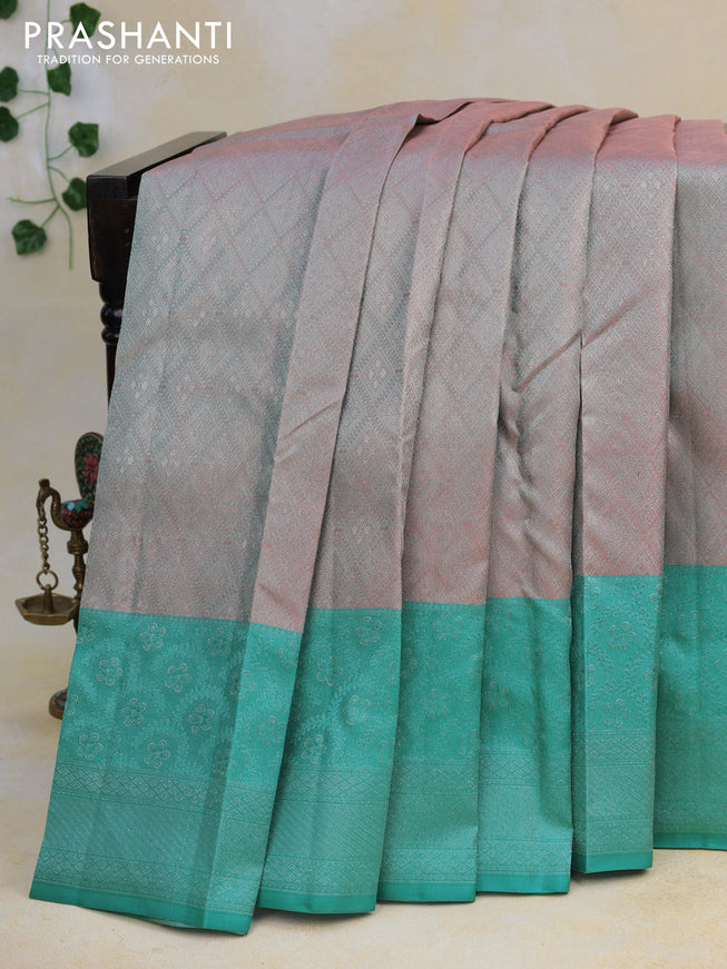 Pure kanjivaram tissue silk saree dual shade of peach and teal blue with allover silver zari weaves and long silver zari woven border