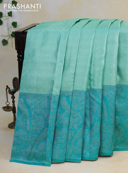 Pure kanjivaram tissue silk saree teal blue and cs blue with allover silver zari weaves and long silver zari woven border