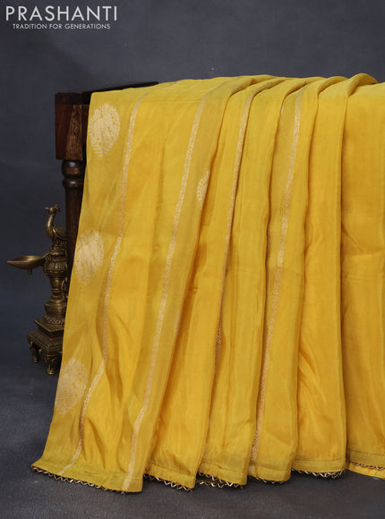 Satin crepe silk saree yellow and sap green with allover zari weaves & elephant zari buttas and beaded work border