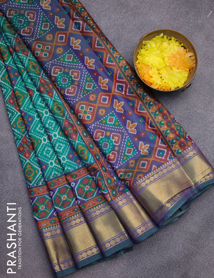 Semi tussar saree teal green and dual shade of blue with allover ikat prints and zari woven border